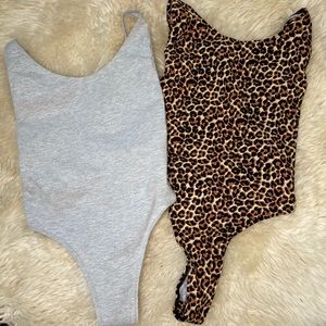 Two American Apparel Bodysuits